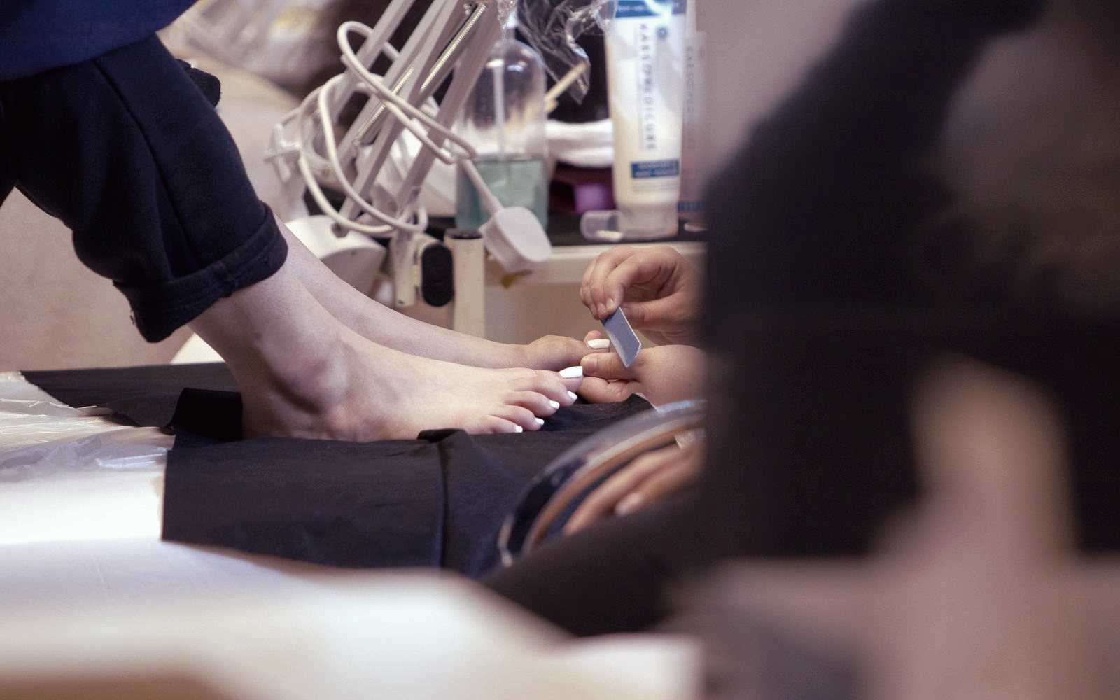 A learner practising a pedicure treatment at the Feltham beauty and nails hub