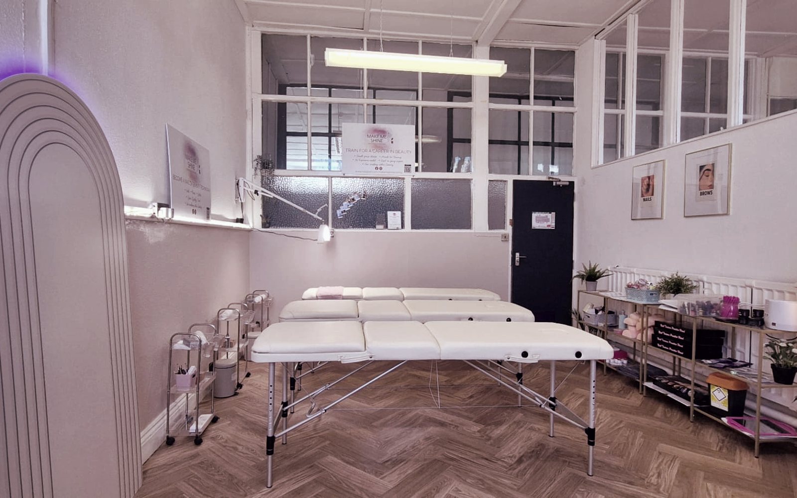 Treatment beds and beauty stations in the AAX Academy Coventry training salon