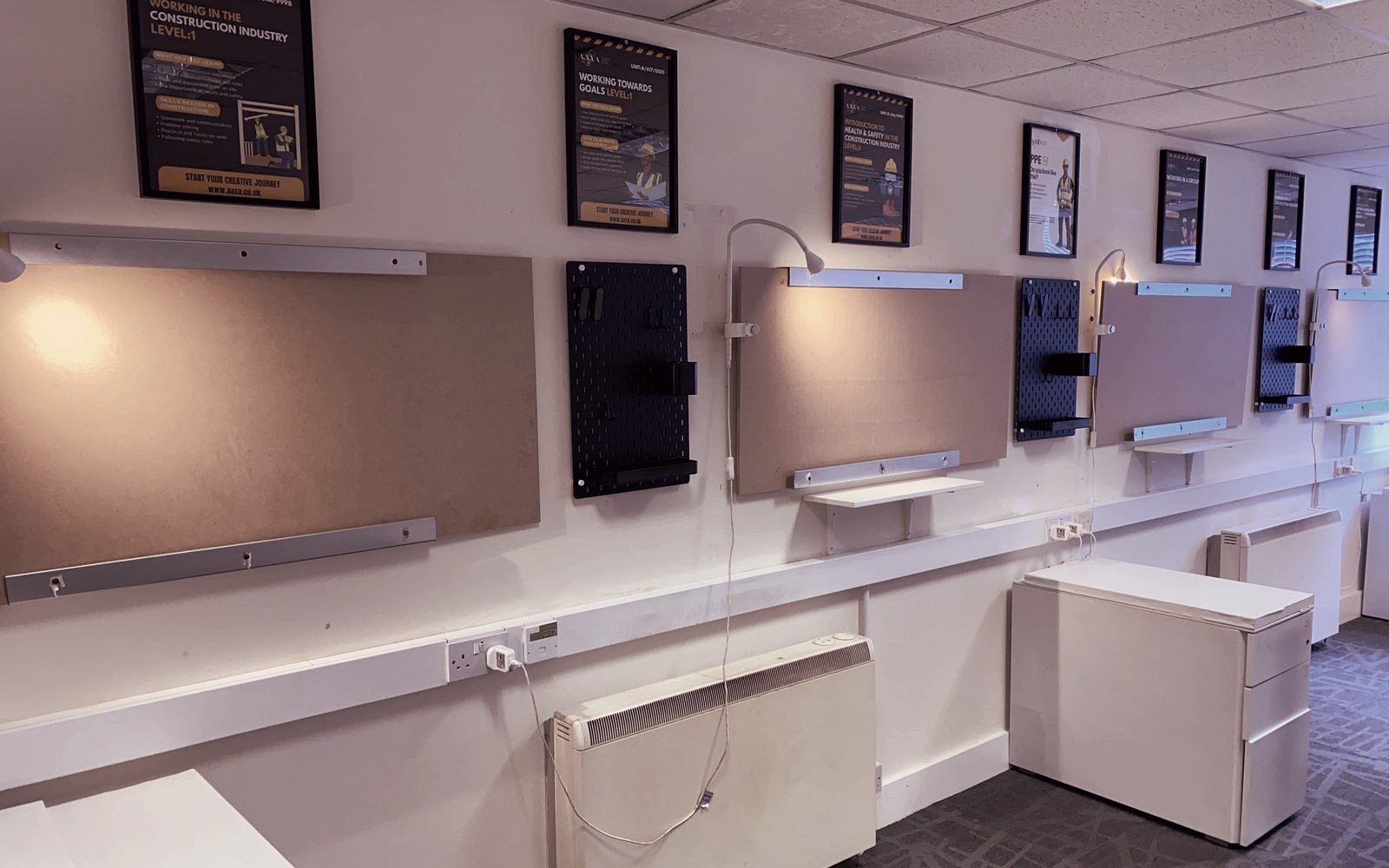 Practice boards and tool walls at the Feltham trade and construction hub