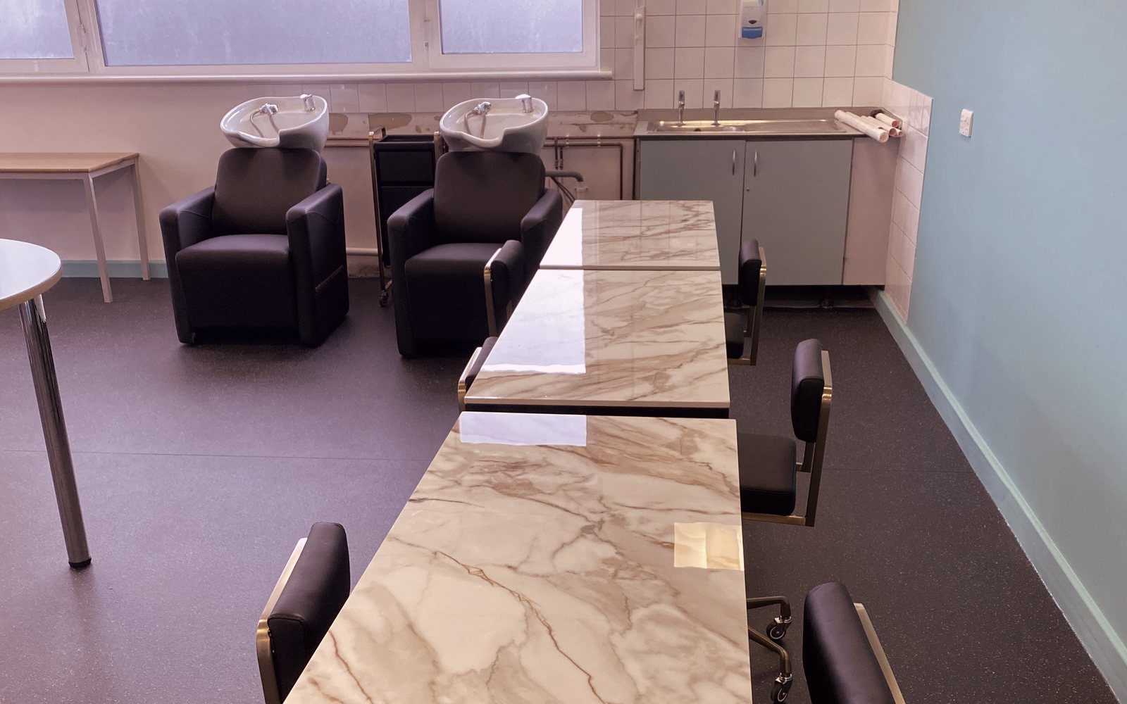 Marble-top nail stations and backwash basins at the Ealing partnership hub