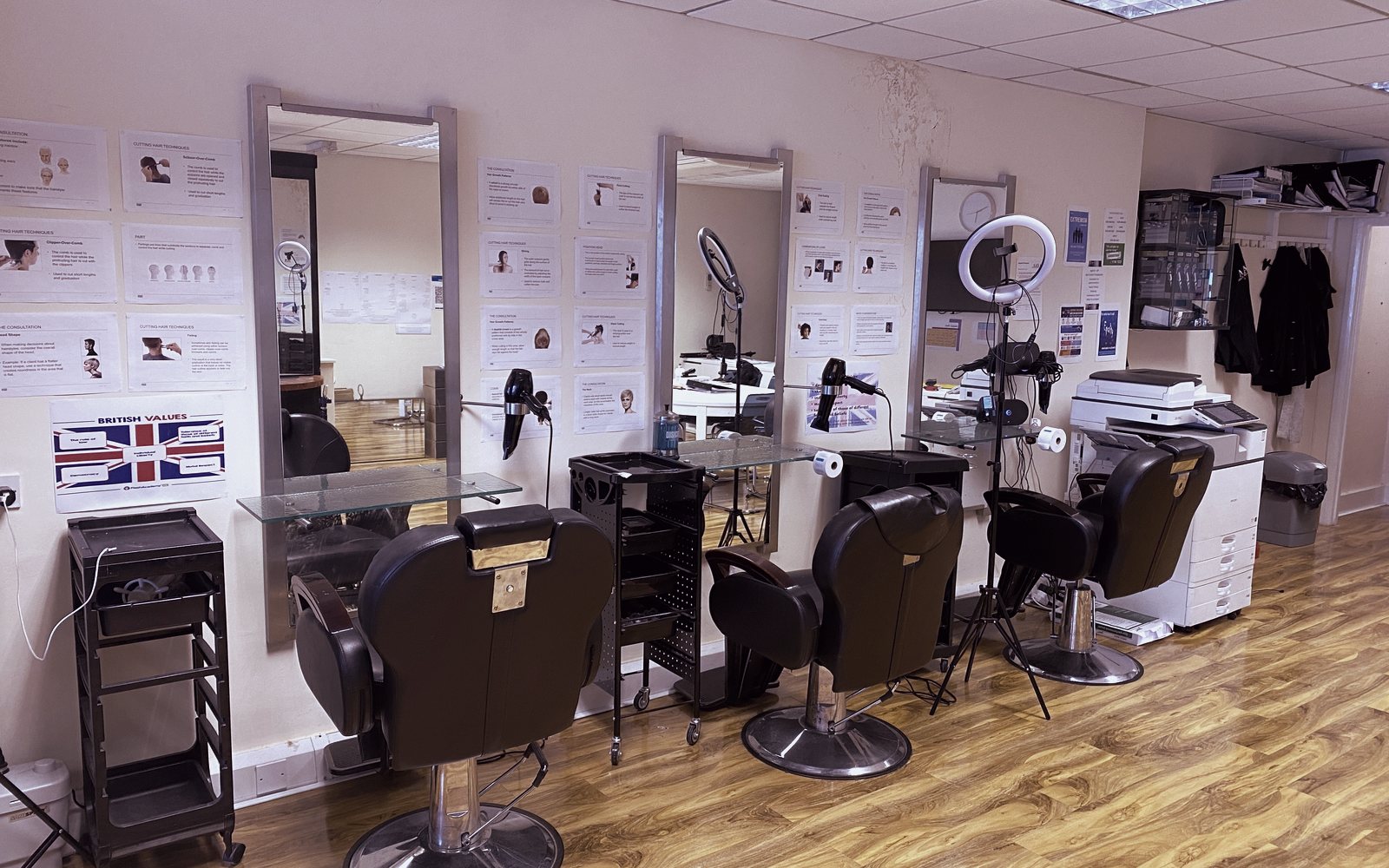 Barber chairs, mirrors and technique posters at the Feltham hub